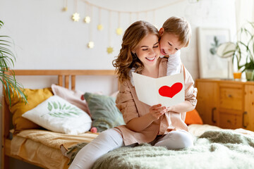 Wall Mural - mother and son reading greeting card