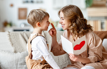 Wall Mural - mother and son reading greeting card