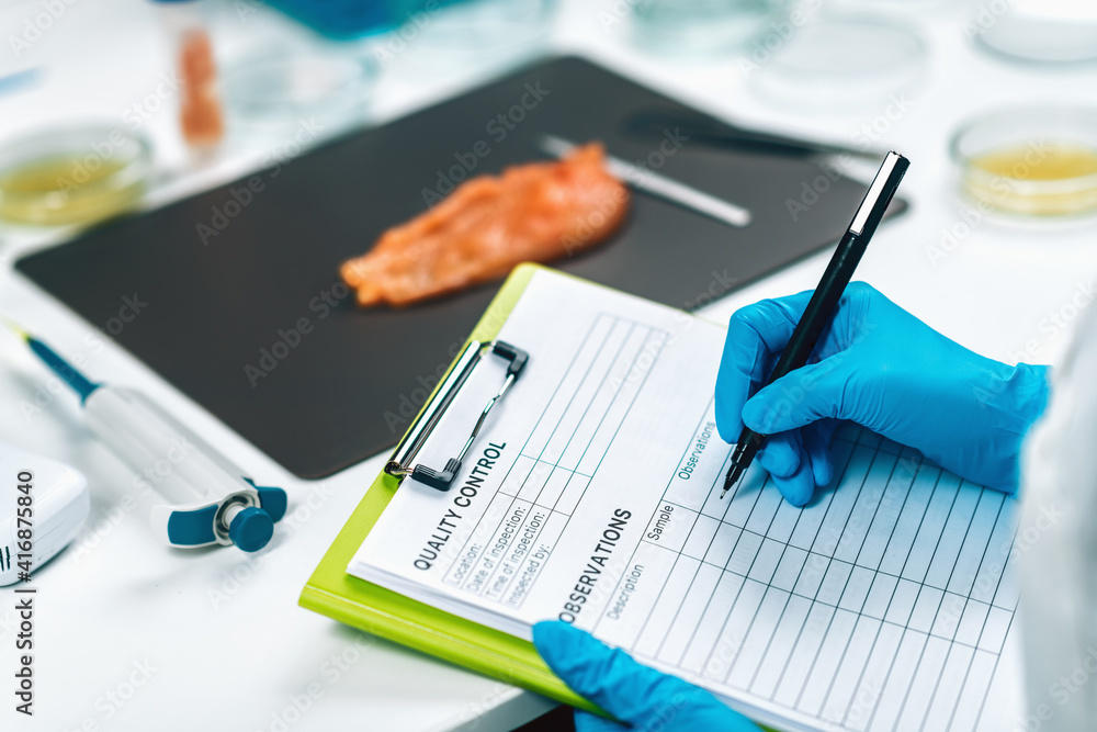 Food Safety and Quality Management. Inspector Filling Out Quality ...