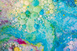 Overflows and bubbles of acrylic paint in liquid, many colors