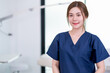© narong - Beauty clinic worker stand with confidence action in workplace area and looking at camera. Beauty business for good appearance to people concept.