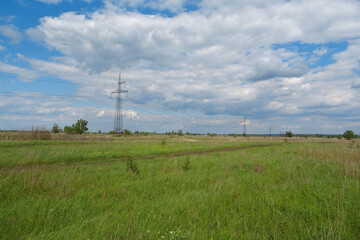 Power transmission towers and clouds