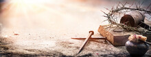 Passion Of Jesus Christ - Hammer And Bloody Nails And Crown Of Thorns On Arid Ground With Defocused Background