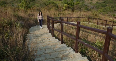 Wall Mural - Woman go hiking and walking on mountain