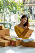 © PaeGAG - Start up successful small business owner, a freelance young Asian female merchant preparing a package box to deliver to customers, SME entrepreneurs, online business ideas, bloggers