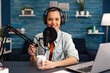 Influencer wearing headphones recording new podcast series at home studio for youtube channel. On-air online production internet broadcast show host streaming live social media content
