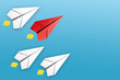 © Rustam Kholov - Red paper plane leading among a white planes on blue background. Business competition and Leadership concept
