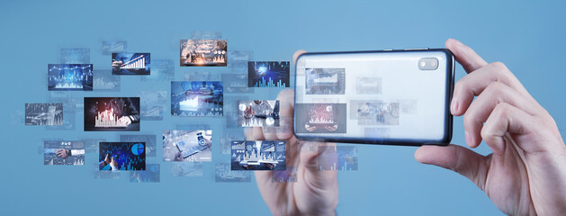 Canvas Print - male hands with a smartphone taking a digital pictures of business graphs. business. technology