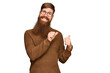 © Krakenimages.com - Young irish redhead man wearing casual clothes and glasses pointing to the back behind with hand and thumbs up, smiling confident