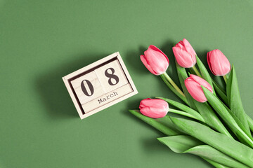 Wall Mural - beautiful pink tulips and calendar on pastel green background. concept women's day, march 8. 8th mar