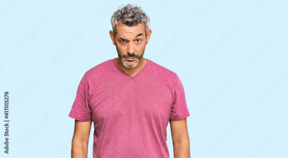 Middle age grey-haired man wearing casual clothes skeptic and nervous, frowning upset because of problem. negative person.