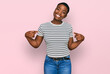 © Krakenimages.com - Young african american woman wearing casual clothes looking confident with smile on face, pointing oneself with fingers proud and happy.