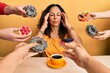 Beautiful middle age woman drinking a cup of coffee around pastries with hand on head, headache because stress. suffering migraine.