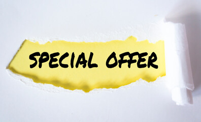 The word special offer appearing behind torn paper