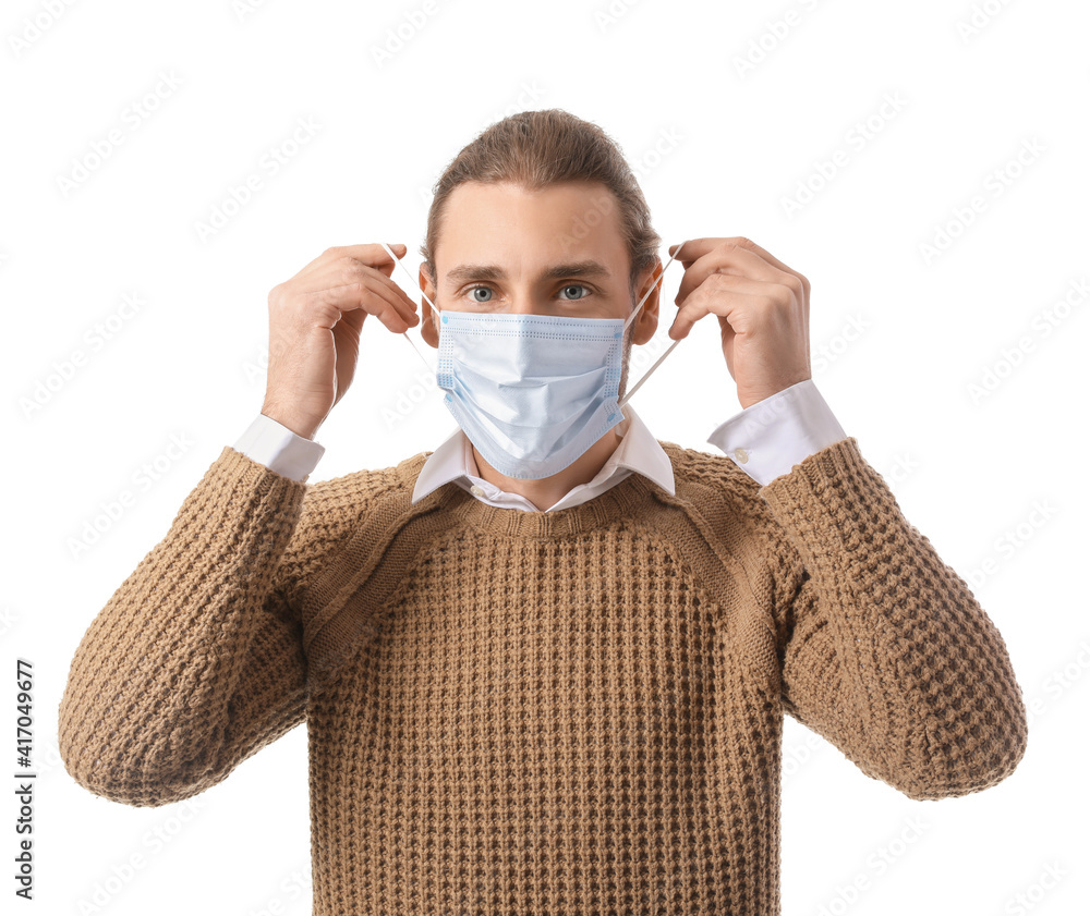 Man wearing medical mask on white background