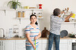 © Pixel-Shot - Mature couple cleaning their kitchen