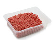 raw fresh beef minced meat in plastic container on white background