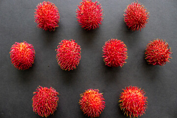 rambutan, sweet red rambutan fruit isolated on black background