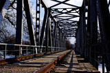 Fototapeta Most - an abandoned railway bridge over a frozen river