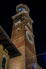 Wall Mural - Medieval Torre del Comune (or Torre dei Lamberti, 1464) in the middle of Market's square (Piazza delle Erbe). Verona, Veneto region, Italy.