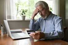Upset Senior 60 - 70s Aged Man Worried About Finance Safety Data, Online Payment Security. Mature Retired Grey Haired Male Bank Client Concerned About Problem With Credit Card, Financial Fraud Threat