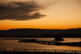 Fototapeta Pomosty - 潟湖を照らす美しいオレンジ色の夕日 | 福島県相馬市の松川浦