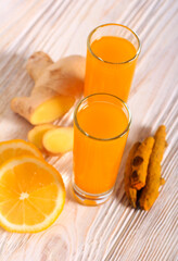 Wall Mural - ginger and turmeric drink in glasses