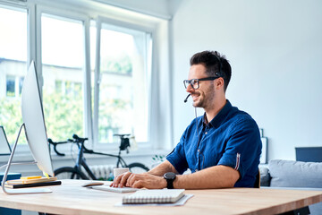 cheerful consultant working at home