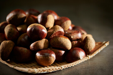 Sticker - Fresh chestnuts on dark background 