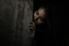 Scared Woman Hiding Behind Wall In Dark Room Young Crazy Scared And Shocked Asian Woman Escape Murderer And Get Frightened Copy Space Facial Expression, Human Emotion Concept Looking Horror Halloween