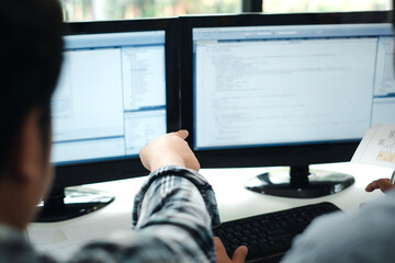 Group of programming analyzes the concept of creating using computers, documents placed at the office table.
