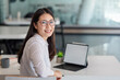© amnaj - Image  young of  Asian woman working at the office looking at camera. Mock up.