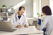 © Studio Romantic - Healthcare in a hospital or private clinic. Middle-aged doctor writes a prescription to a female patient in his hospital office. Concept of disease prevention and consultations in the medical clinic.