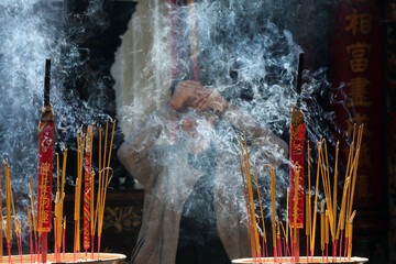 Wall Mural - Taoist temple. Phuoc An Hoi Quan Pagoda. Incense sticks on joss sticks. Buddhist Worshipper. Ho chi Minh City. Vietnam.  25.02.2017