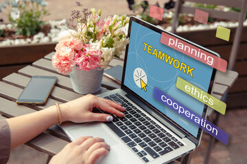 teamwork and web concept. young woman working at a computer