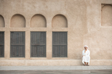 Wall Mural - arab man in traditional clothing in old Dubai