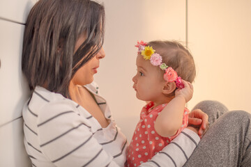 Happy loving family. mother and child girl playing, kissing and hugging