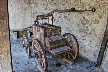 Vintage fire water pump in castle