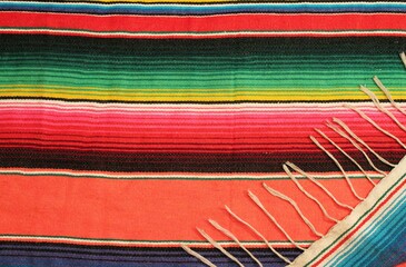 Wall Mural - poncho serape background Mexican cinco de mayo serape fiesta wooden copy space. Mexican poncho are tradition Mexican cultre