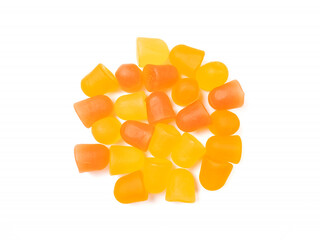 Close-up texture of orange and yellow multivitamin gummies. Healthy lifestyle concept.