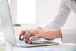 © Monster Ztudio - Close up image of businessman hands working computer laptop searching or typing text message for new project on desk in office room
