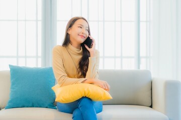 Wall Mural - Portrait beautiful young asian woman with smart mobile phone