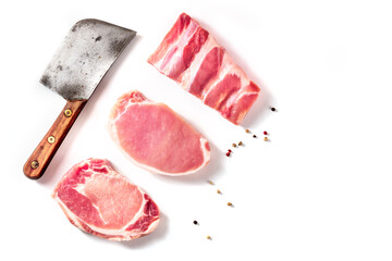 Wall Mural - Raw pork meat, different cuts, shot from above on a white background with copy space