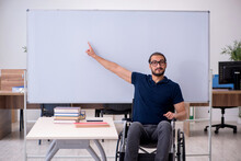 Young Male Handicapped Student In The Classroom