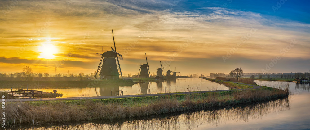 Rotterdam Netherlands, sunrise panorama nature landscape of Dutch Windmill at Kinderdijk Village - obrazy, fototapety, plakaty 