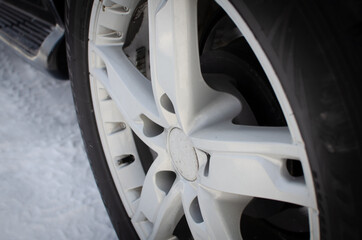 Wheel with a disk from the car in winter.