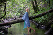 © Algimantas - Portrait of a naked elegant girl in a green forest with a blue scarf