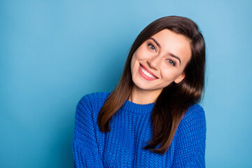 Wall Mural - Portrait of young lovely pretty dreamy good mood cheerful positive girl smiling on camera isolated on blue color background