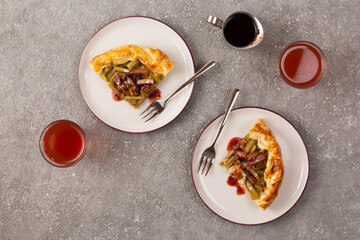 Wall Mural - Delicious rhubarb tart on gray background. top view