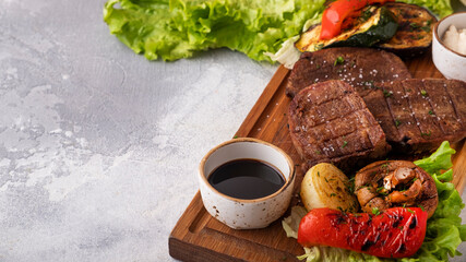 Wall Mural - Grilled beef tongue with vegetables. Text space